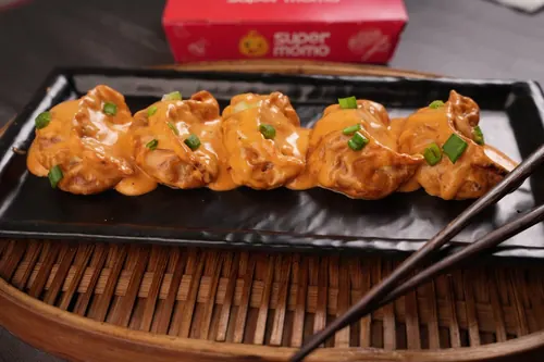 Chicken Pan Fried Momo in Butter Masala